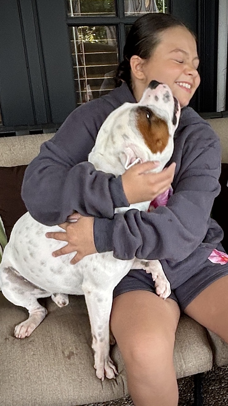 Rocky sharing an affectionate moment with a child